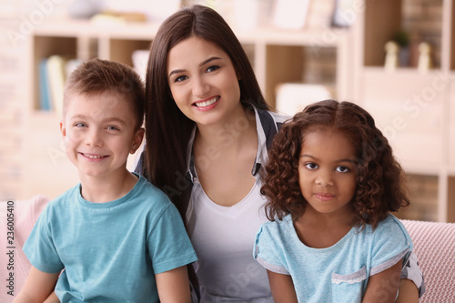 Young woman with little kid...