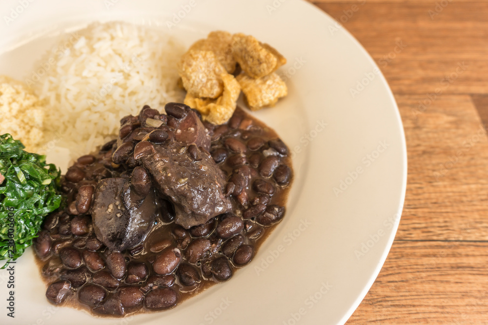 White dish with ingredients of feijoada, typical food of Brazil White dish with ingredients of feijoada, typical food of Brazil