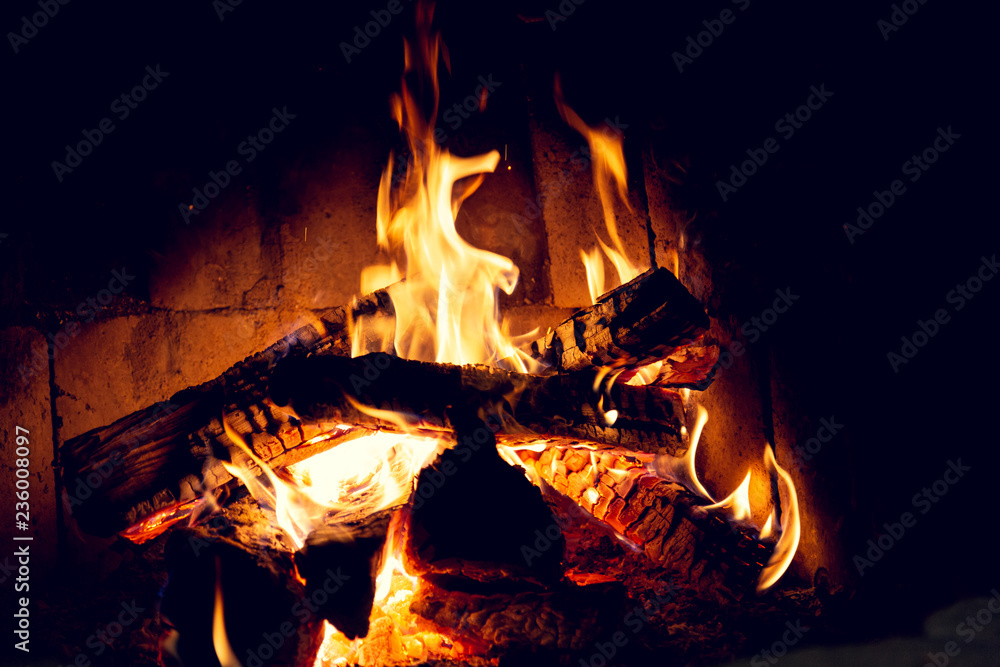 Fototapeta premium Fire in an old home fireplace.