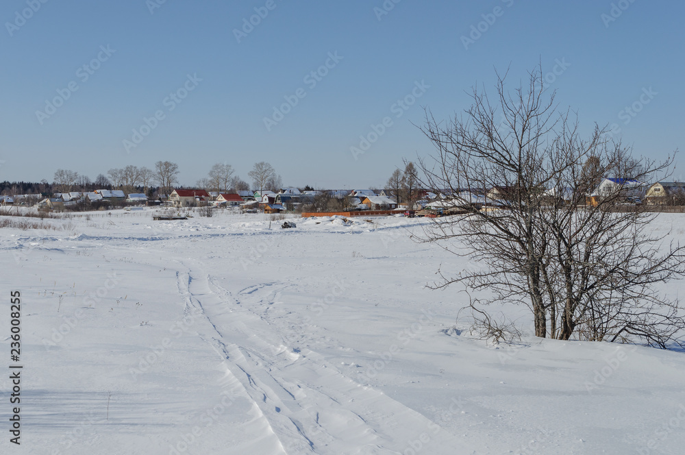 Winter landscape with small village
