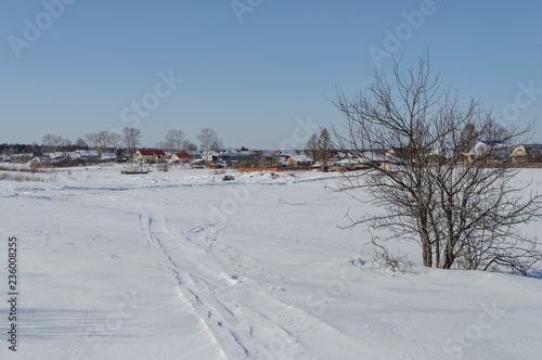 Winter landscape with small village © Vic