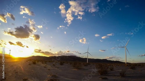 Beautiful setting sun behind the Ocotillo wind farm in the desert of southern California. photo