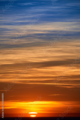 burning clouds in the evening sky after sunset