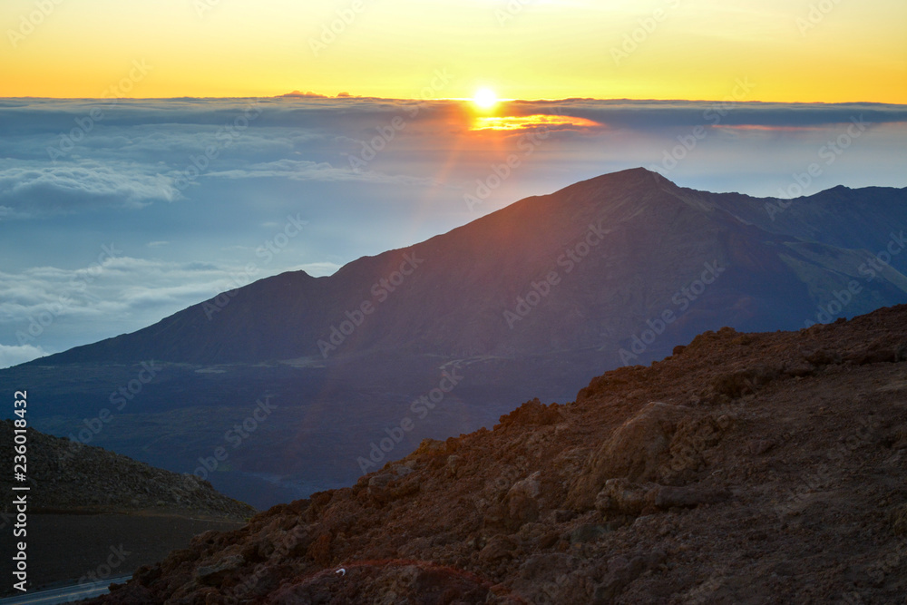 Sunrise at the summit of Haleakala volcano on the island of Maui, Hawaii. Sunrise at the summit of Haleakala volcano on the island of Maui, Hawaii.