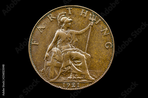 Obraz na plátně UK 1921 Farthing coin, showing Britannia seated, wearing a helmet, holding a trident, hand resting on a shield, with the word FARTHING around the top and 1921 date isolated on black background