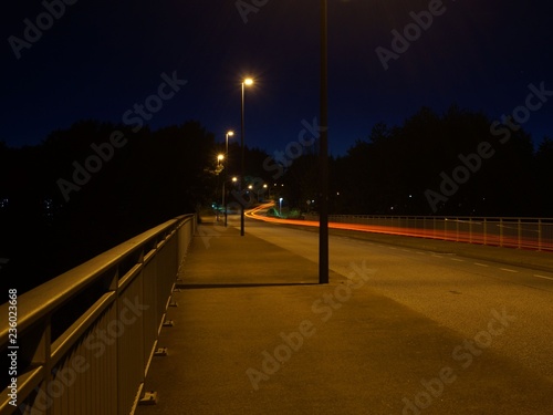 Cityscape. Rroad at night, headlights photo