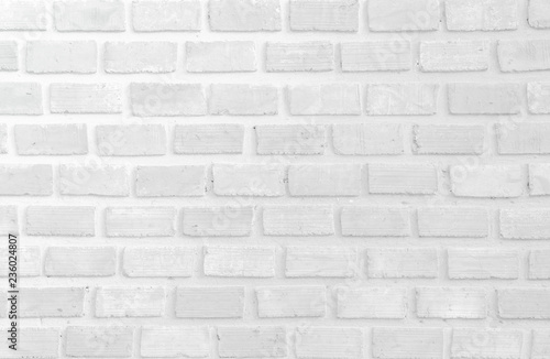 Wall stained old grungy stucco texture background. Brickwork flooring interior rock old pattern clean concrete have grid uneven design stack. Abstract kitchen wallpaper modern white brick tile. © Phokin
