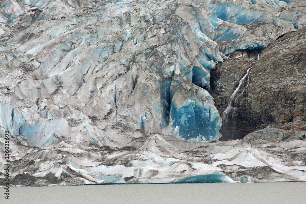 Mendenhall Glacier closeup on an overcast summer day showing the saturated blues of glacial ice.
