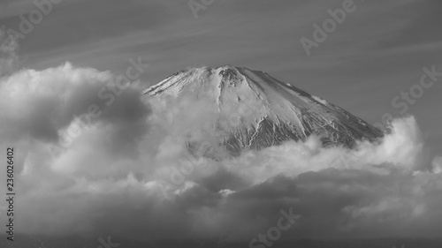 clouds over the mountain in black and white