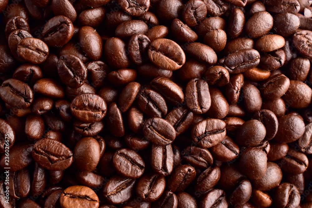 roasted coffee beans background , macro roasted coffee beans background , macro