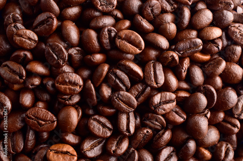 roasted coffee beans background , macro