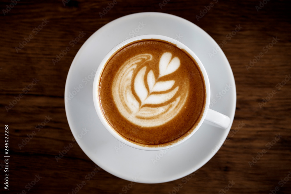 Latte Coffee art on the wooden table Latte Coffee art on the wooden table