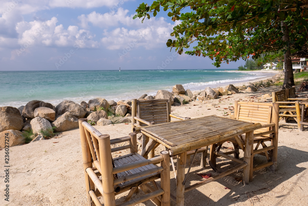 Table and chairs on the beach. Chaloklum beach Koh Phangan, Thailand.