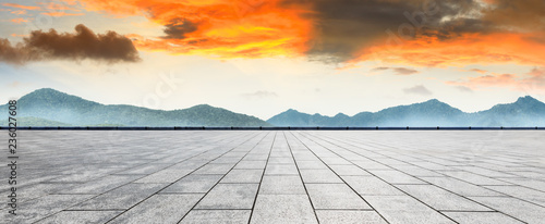 Empty floor and mountain with beautiful clouds at sunset