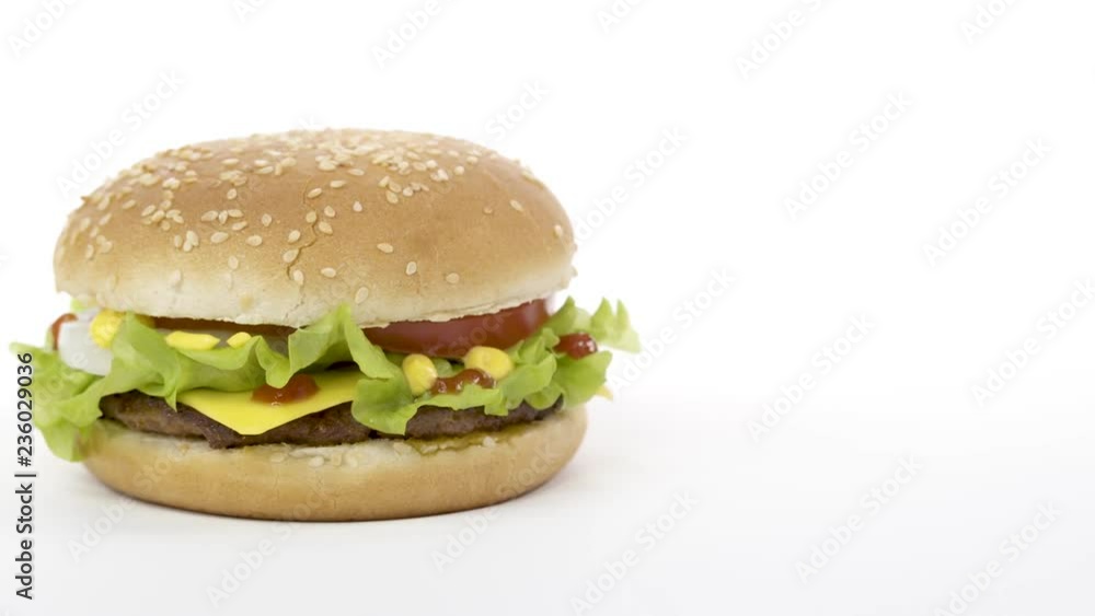 Rotation. Appetizing burger on a white background. Rotation. Appetizing burger on a white background.