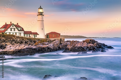 Portland Head light at dusk. The light station sits on a head of land at the entrance of the shipping channel into Portland Harbor. Completed in 1791, it is the oldest lighthouse in Maine photo