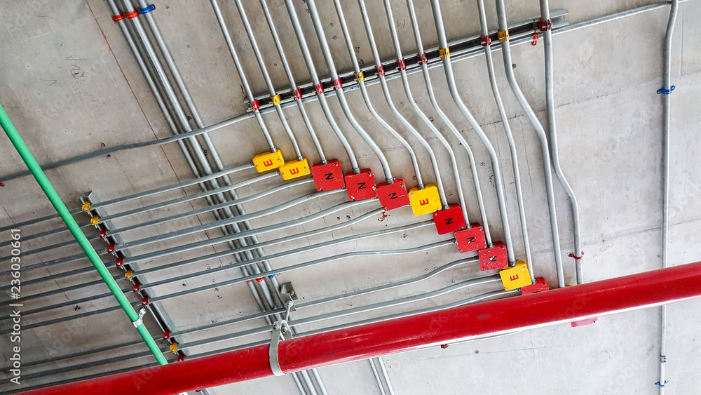 Electrical pipe and junction box on ceiling. Stock Photo Adobe Stock