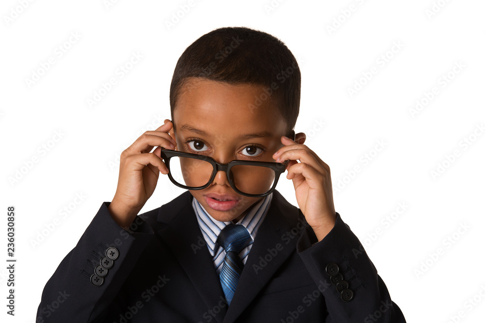 Elegant little boy with glasses in business suit. Studio shot. Isolated
