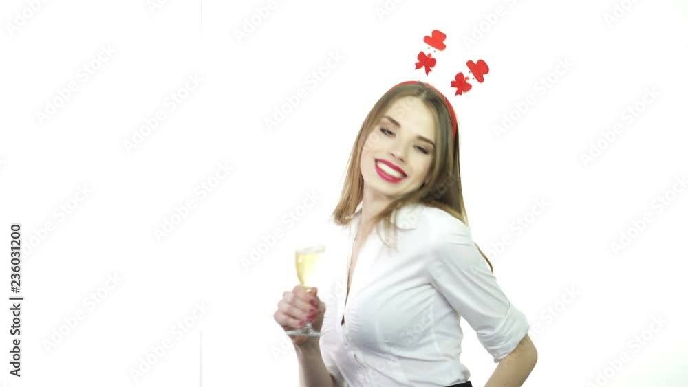 4К. Businesswoman in red Santa hat with glass of champagne dance and smile.Christmas Day 4К. Businesswoman in red Santa hat with glass of champagne dance and smile.Christmas Day