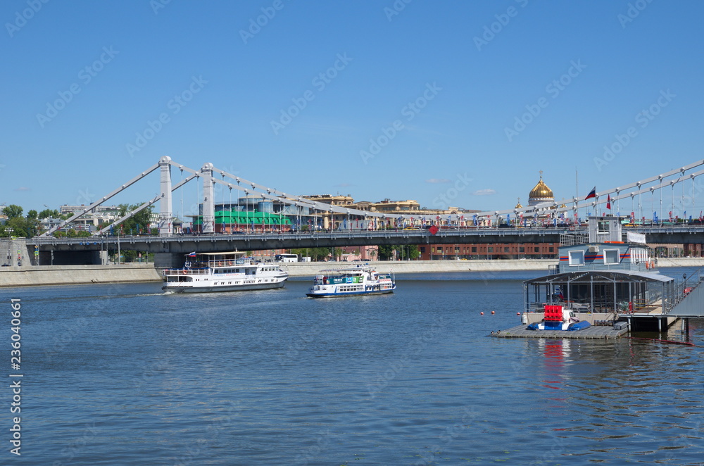 Moscow, Russia - June 15, 2018: Summer view of the Crimean bridge and the Moscow river with pleasure boats