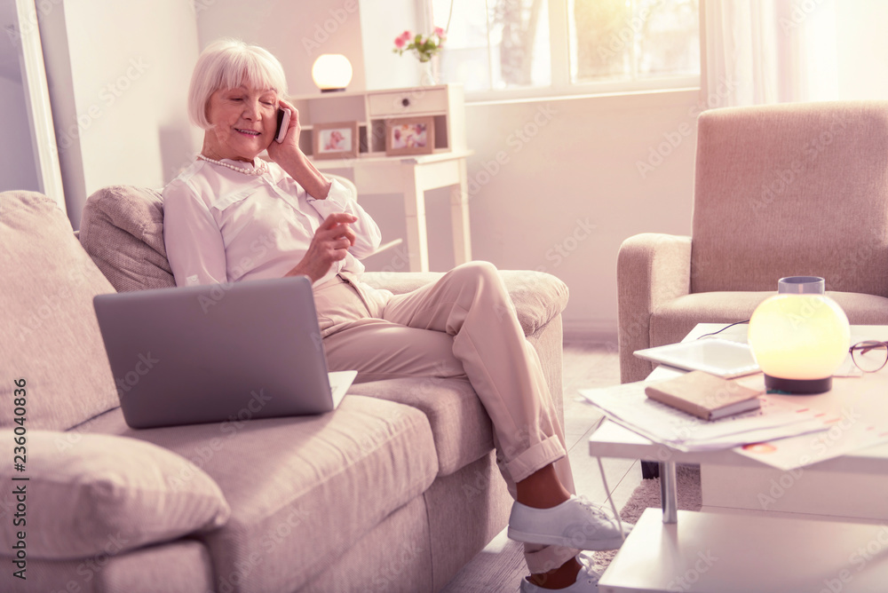 Nice elderly woman having a pleasant conversation Nice elderly woman having a pleasant conversation