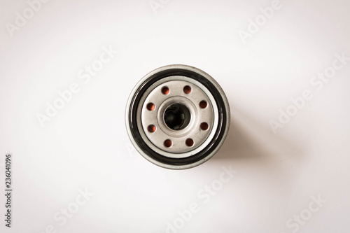 New car oil filter isolated on white background . Close up. Top view