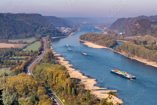 Drought in Germany, low water of the Rhine river in andernach near koblenz influending water transport freight ships