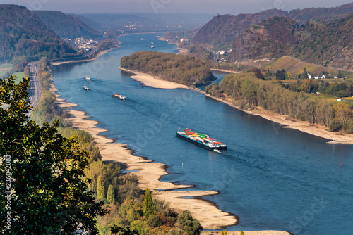 Drought in Germany, low water of the Rhine river in andernach near koblenz influending water transport freight ships