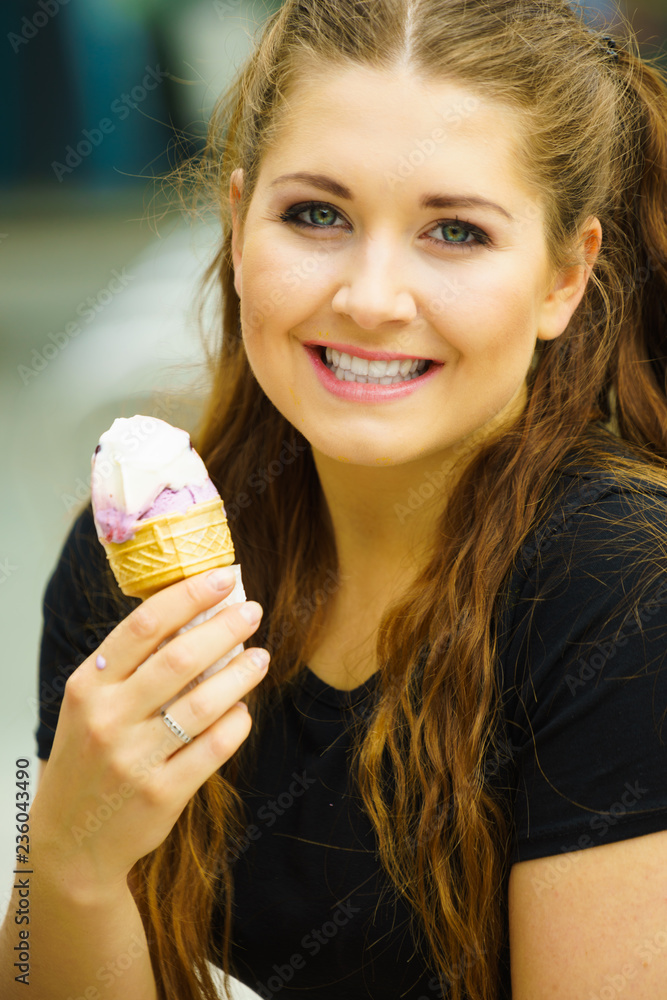 Young woman eating ice cream Young woman eating ice cream