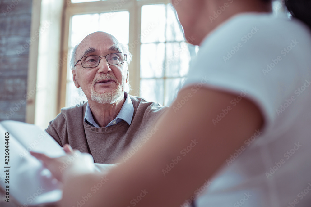 © zinkevych - Attentive bearded man listening to his social helper