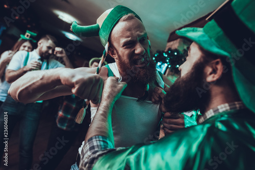 Drunk men fighting in a Saint Patrick's Day at pub
