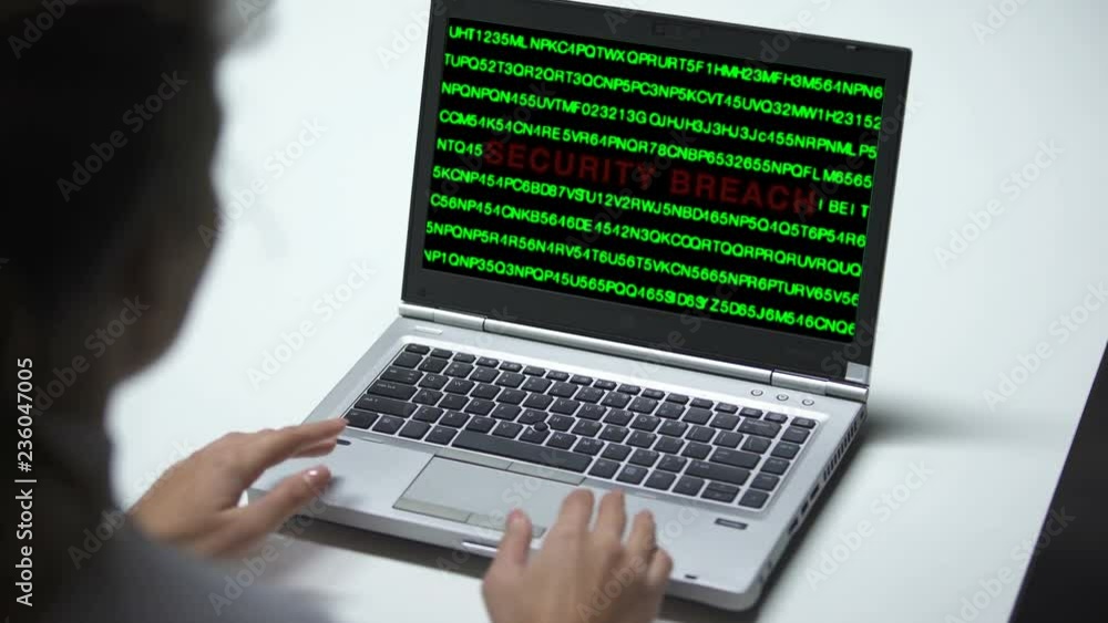 Security breach attack on laptop computer, woman working in office, cybercrime Security breach attack on laptop computer, woman working in office, cybercrime