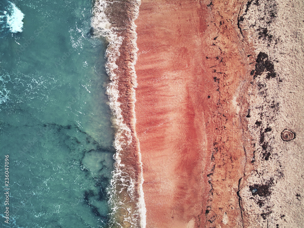 Nature Pattern. Pink Sand With Water Waves On Sea Coast