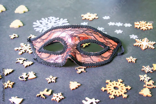 Carnival mask and New Year decor on dark background
