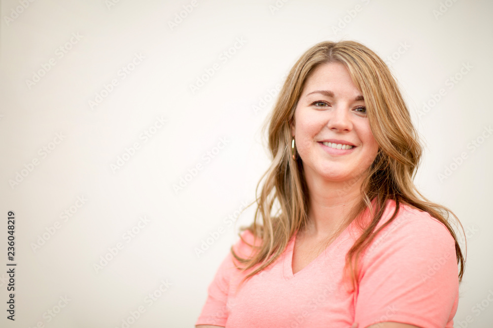 Portrait of a happy blonde woman smiling. Portrait of a happy blonde woman smiling.