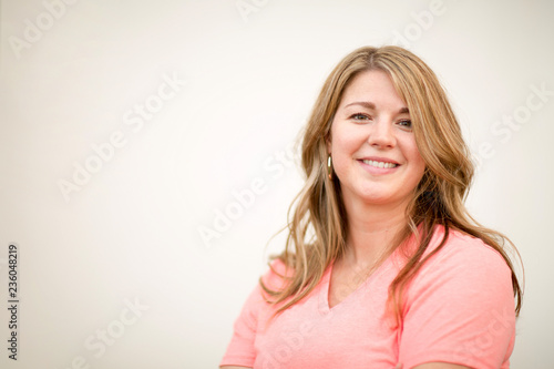 Portrait of a happy blonde woman smiling.