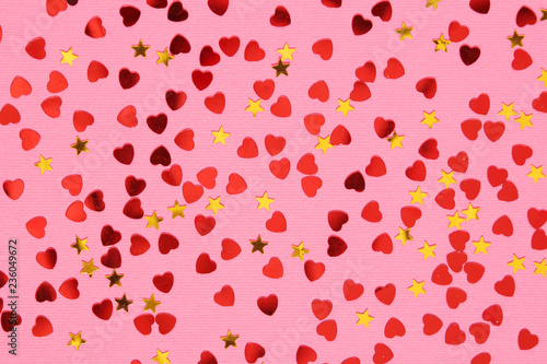 Pink background with red confetti hearts for Valentine Day