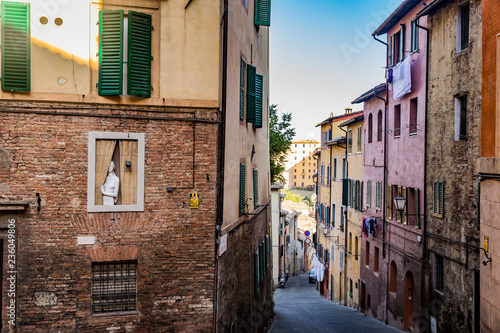 narrow cobblestone street in Siena