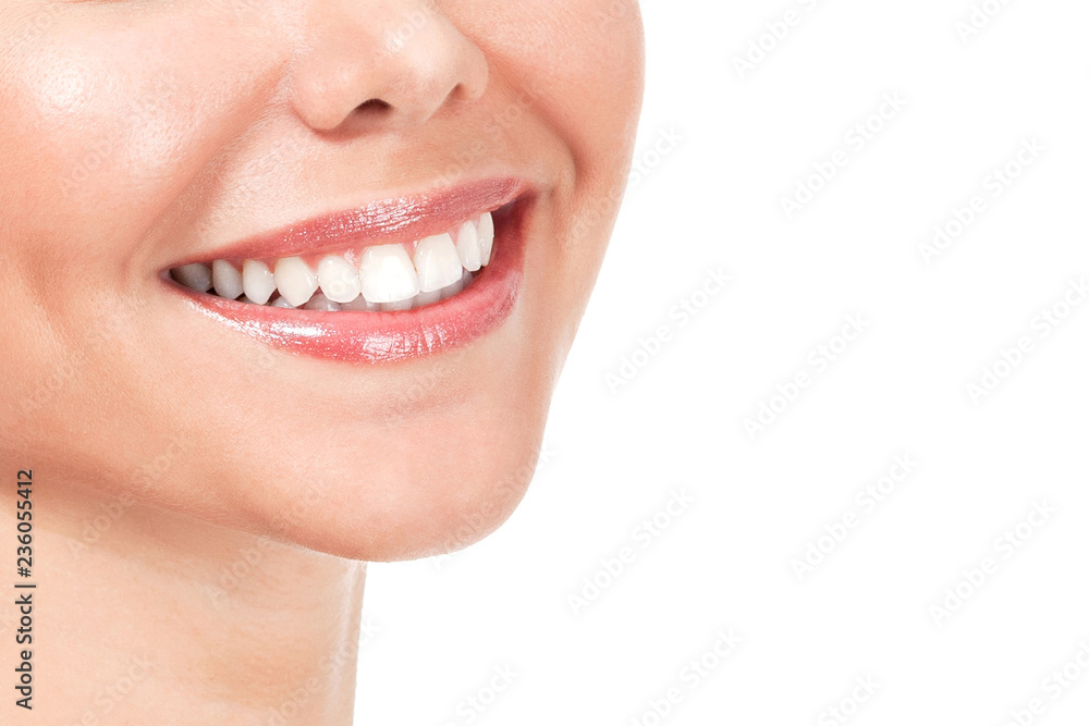 Closeup shot of beautiful female smile, isolated on white background Closeup shot of beautiful female smile, isolated on white background