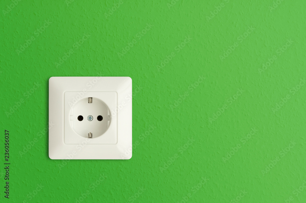 electrical power socket on green wall, green electric power outlet, European standard electrical power socket on green wall, green electric power outlet, European standard
