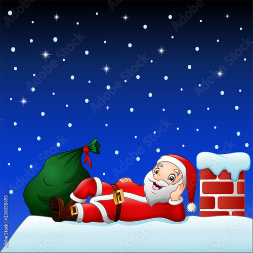 Cute santa claus on the house roof chimney with bag of gifts