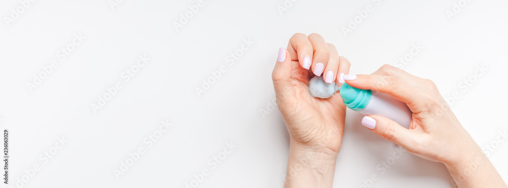 Woman moisturizing her hands with foam lotion Woman moisturizing her hands with foam lotion