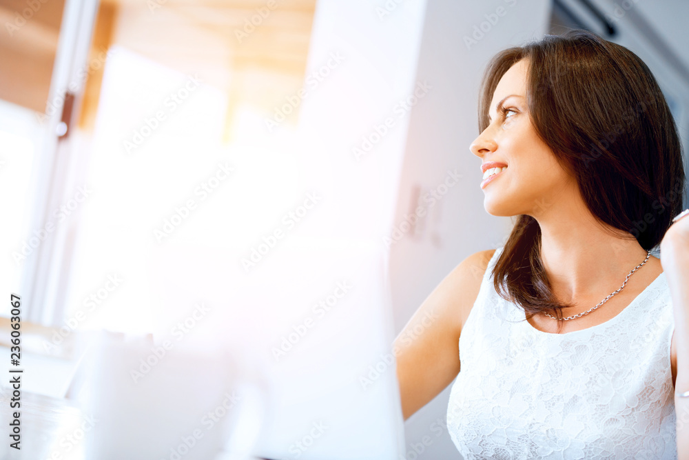 Young beautiful woman working on her laptop Young beautiful woman working on her laptop