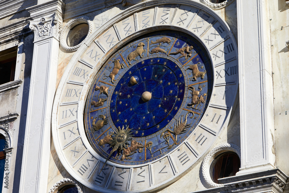 Obraz premium Gold zodiac signs and astronomical clock in a sunny day in Italy