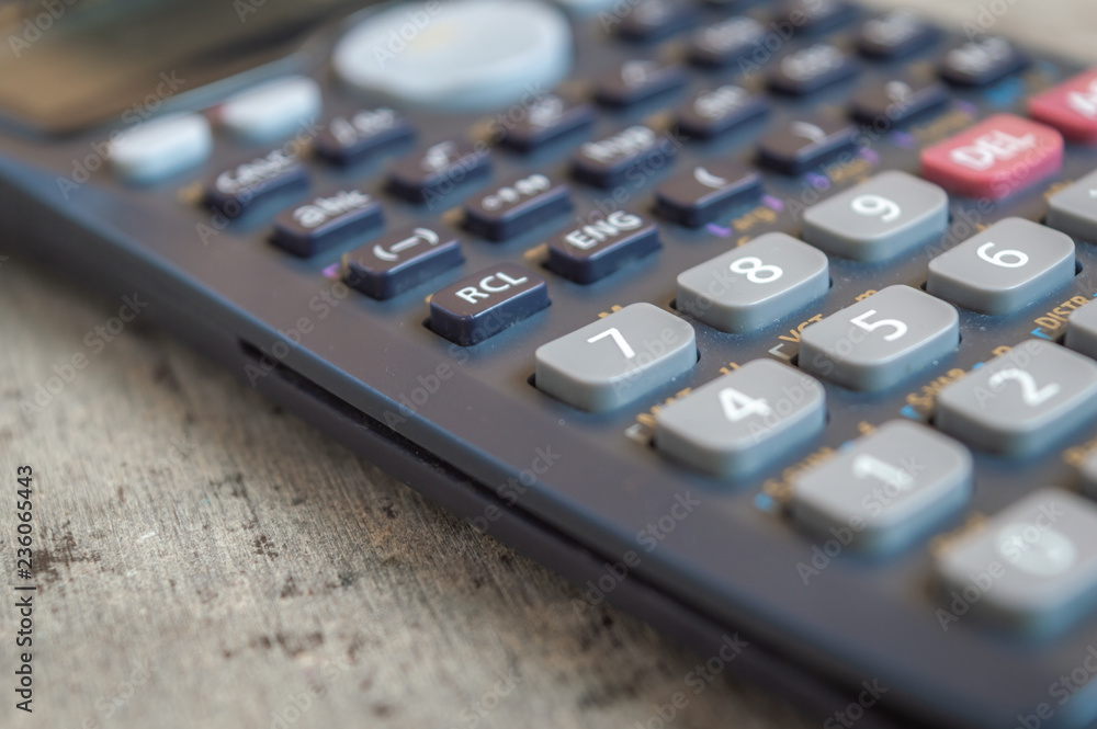 Close up of a black scientific calculator with a shallow depth of field Close up of a black scientific calculator with a shallow depth of field