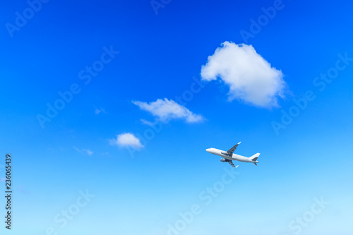 Airplane flying in the blue sky