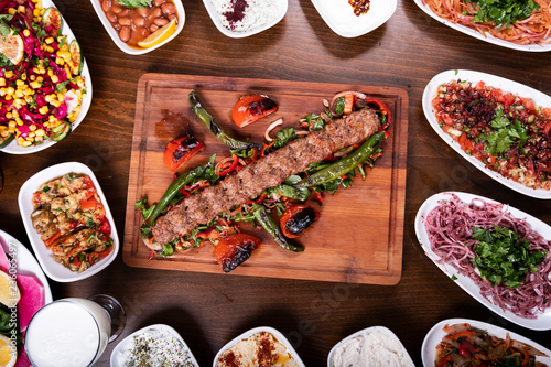 Adana Kebab Set Plate on Wooden Table with Ayran