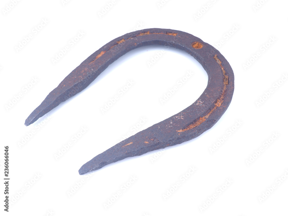 old rusty horseshoe on a white background old rusty horseshoe on a white background