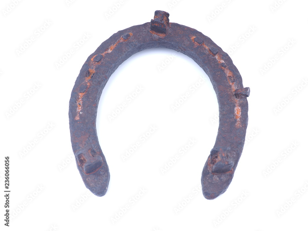 old rusty horseshoe on a white background old rusty horseshoe on a white background