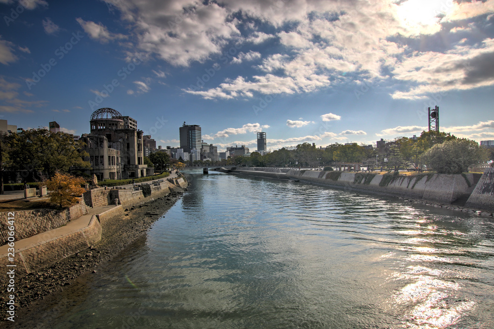 The Motoyasu river flowing past the Atomic Bomb Dome (Genbaku Dōmu) at the Hiroshima Peace Memorial. The Motoyasu river flowing past the Atomic Bomb Dome (Genbaku Dōmu) at the Hiroshima Peace Memorial.